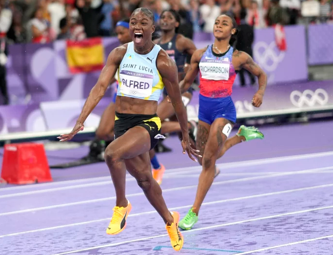 Julien Alfred, of Saint Lucia, celebrates after winning the women's 100-meters final at the 2024 Summer Olympics